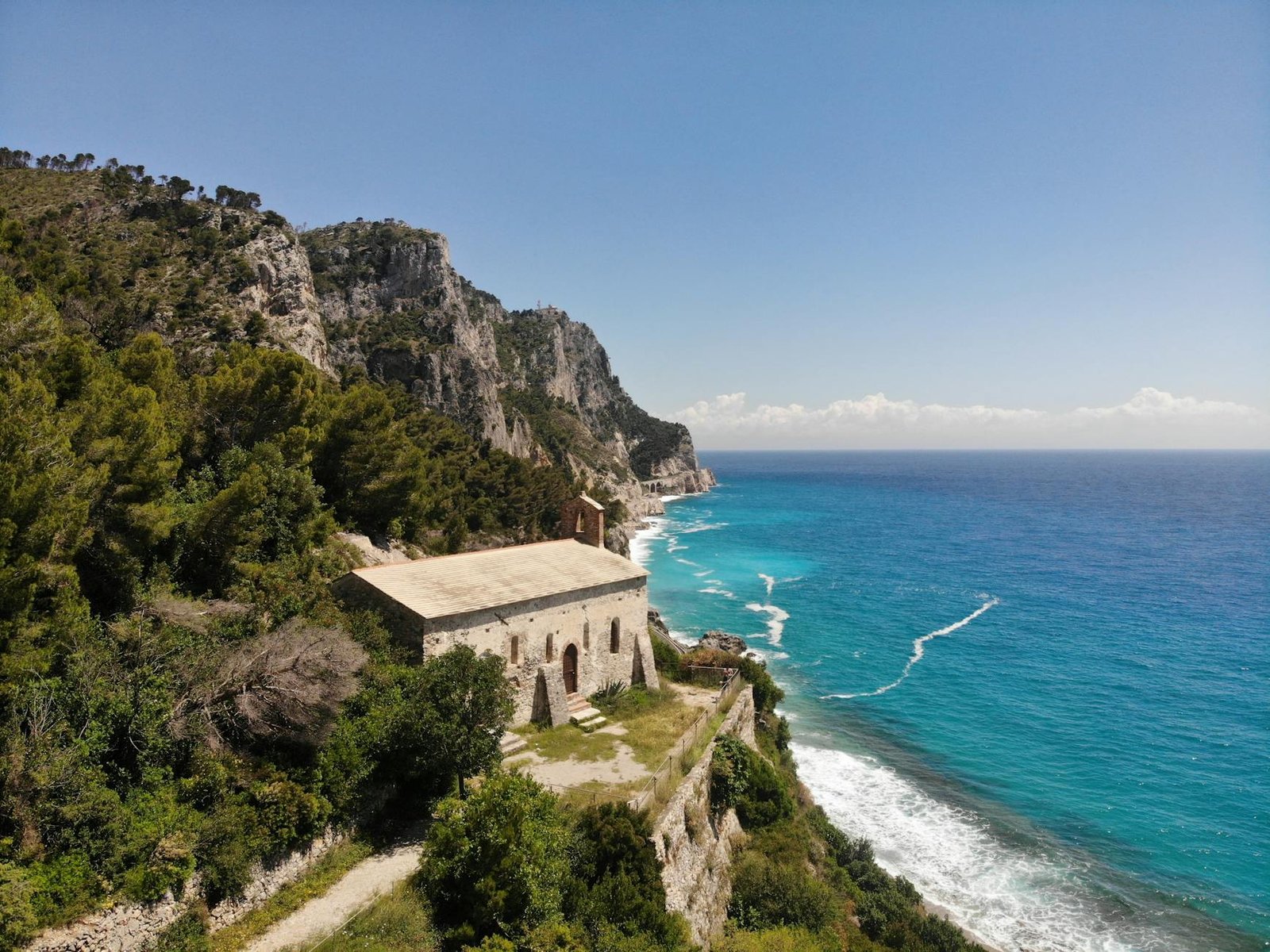 concrete house on bay near body of water